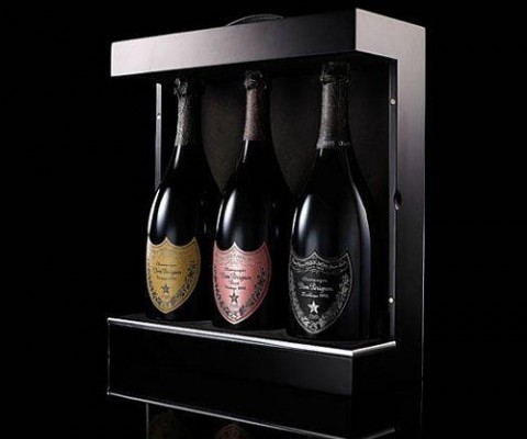 A collection of three vintage Dom Perignon bottles combined in a gift set. 