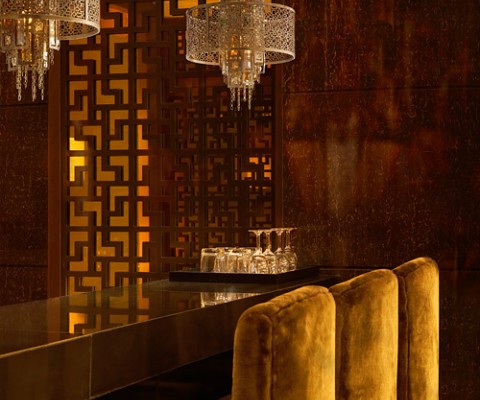 French Inspired Chandeliers from Corbett Lighting. Strands of multi-colored crystal baguettes dangle from a central column adorned in an elaborate, hand-crafted iron enclosure.