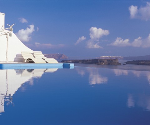 Astarte Suites is a spectacular 9-suite complex designed by Aygoustis Krousis and located on a cliff on the beautiful Santorini Island in Greece. Small, but with impeccable services, infinity pool, and unforgettable views, the hotel is perfect for a romantic getaway. Here is an excerpt from the official description from the architects:
�Magic is in the details at Astarte Suites, beginning with the twinkling Swarovski stones that adorn the ceiling above each suite�s Jacuzzi pool, ending with the personalized service each guest enjoys. Surrounded by soothing shades of white and stone, guests are sure to find bliss here. During their precious down time, guests can relax and unwind next to Astarte�s stunning turquoise infinity swimming pool, which overlooks the Aegean Sea�s tranquil blue waters and nearby rocky cliffs. Leisure and cultural options abound nearby, such as in Akrotiri, an ancient city buried and preserved by volcanic ash-known as the Pompeii of the Greek islands-and at Red Beach and White Beach, the ultimate locales for a spectacular day of fun in the sun�.
