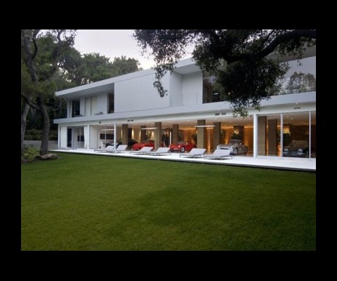 This is the ultimate home for the ultimate car collector. Priced at $35 million, it houses a garage/display area big enough to house 35 cars and is on sale with JamesList.
